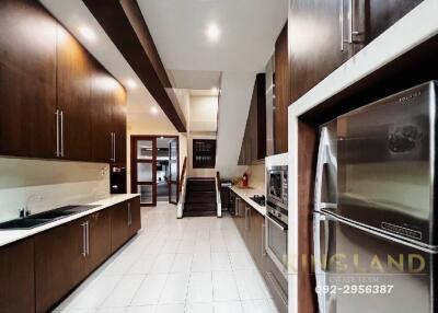 Spacious modern kitchen with ample storage and stainless steel appliances