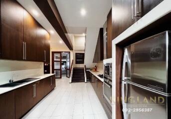 Spacious modern kitchen with ample storage and stainless steel appliances