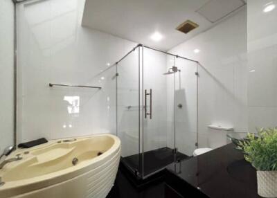 modern bathroom with glass shower and bathtub