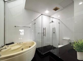 modern bathroom with glass shower and bathtub