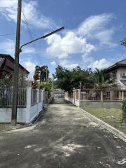 Residential street view with houses and greenery