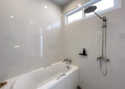 Modern bathroom with bathtub and shower