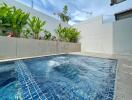 Beautiful backyard pool area with plants