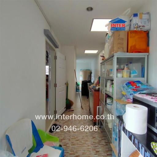 Interior of a utility room with shelving and various supplies