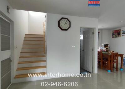 Main living area with a staircase and dining area