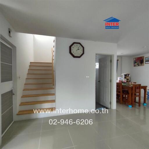 Main living area with a staircase and dining area