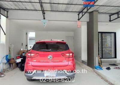 Garage with a parked red SUV