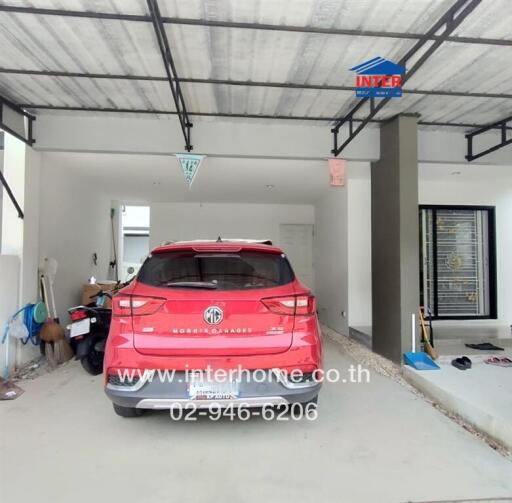 Garage with a parked red SUV