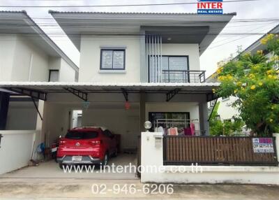 Two-story house with a carport