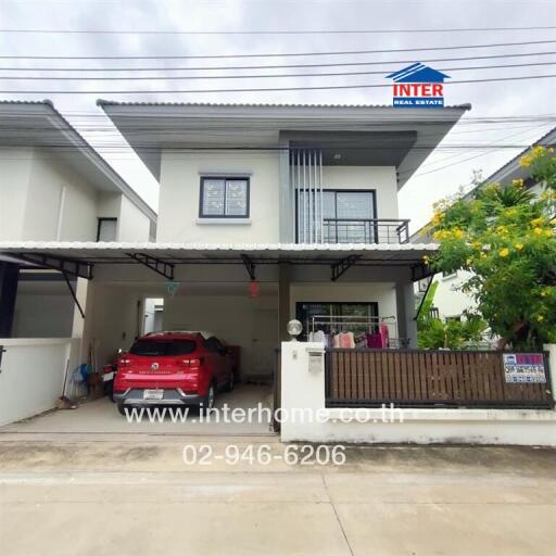 Two-story house with a carport