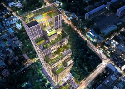 Aerial view of a modern high-rise building with multiple rooftop gardens and surrounding cityscape