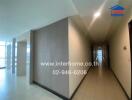 Hallway in a building with bright natural lighting and tiled floors