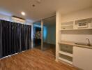 Open living space with kitchenette and sliding glass doors