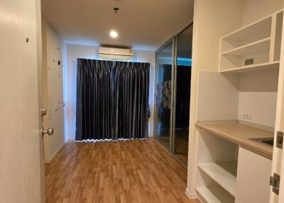 Living area with kitchenette and sliding door