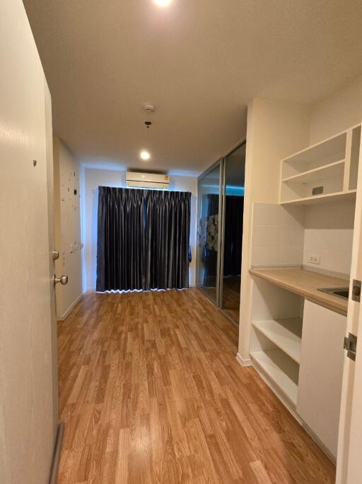 Living area with kitchenette and sliding door