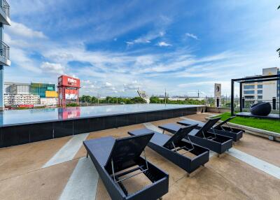 Outdoor pool area with lounge chairs