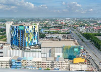 Aerial view of a commercial and residential area with buildings and roads