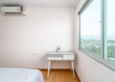 Modern bedroom with large window and air conditioning