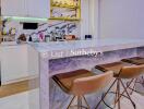 Modern kitchen with marble breakfast bar and bar stools