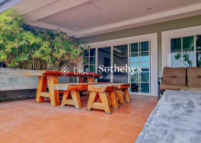 Patio with wooden furniture and sliding glass doors