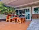 Patio with wooden furniture and sliding glass doors