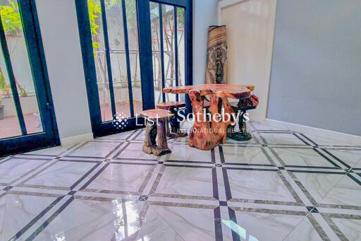 Dining area with wooden table and stools