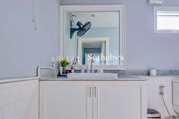 Bathroom with sink and mirror