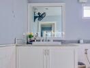 Bathroom with sink and mirror