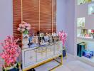 Decorated living space with decorative cabinet and open shelves