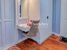 Cozy bedroom with a vanity desk and chair, surrounded by ample closet space