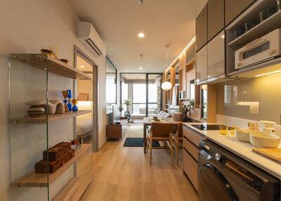 Modern kitchen and dining area with wooden flooring and contemporary furnishings