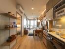 Modern kitchen and dining area with wooden flooring and contemporary furnishings