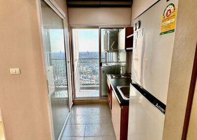 compact kitchen with balcony view