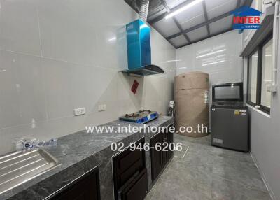 Modern kitchen with stove, sink, and storage space