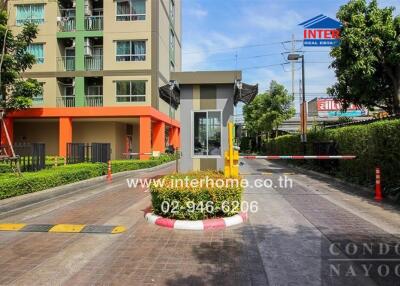 Entrance of a residential complex with security booth