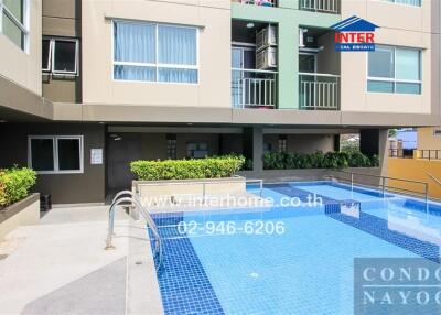 Outdoor pool area in condominium building