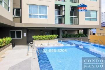 Outdoor pool area in condominium building