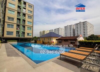 Condominium exterior with swimming pool