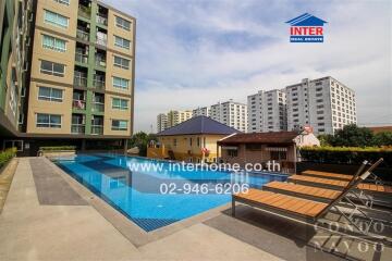 Condominium exterior with swimming pool