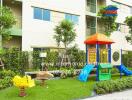 Children's playground area outside a residential building