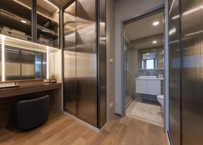 Modern bathroom with large mirror and ample storage