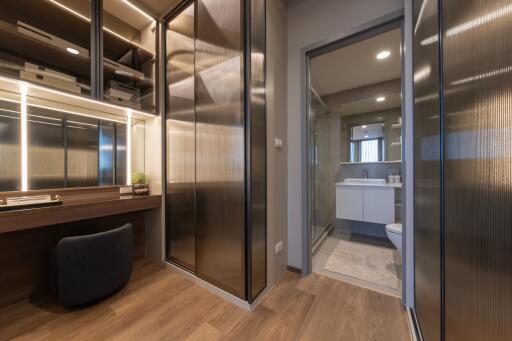 Modern bathroom with large mirror and ample storage