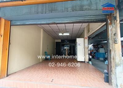 Vacant Garage Space with Rolling Doors and Interior View