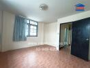 Bedroom with window and open door