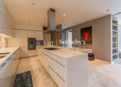 Modern kitchen with marble countertops and island