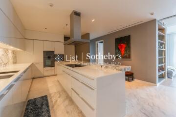 Modern kitchen with marble countertops and island