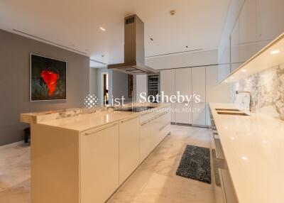 Modern kitchen with marble countertops and island