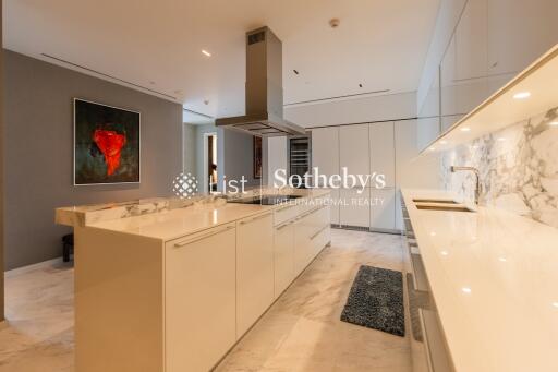 Modern kitchen with marble countertops and island