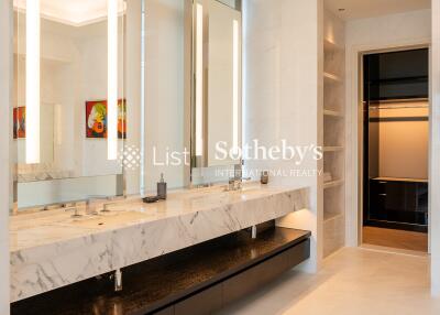 Modern bathroom with dual sinks and large mirrors