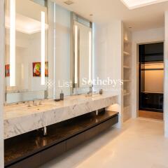 Modern bathroom with dual sinks and large mirrors